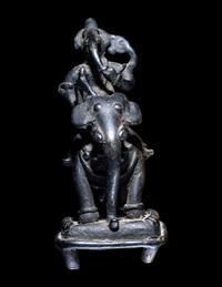 An Indian Bronze Figural Group of Ganesha Riding an Elephant