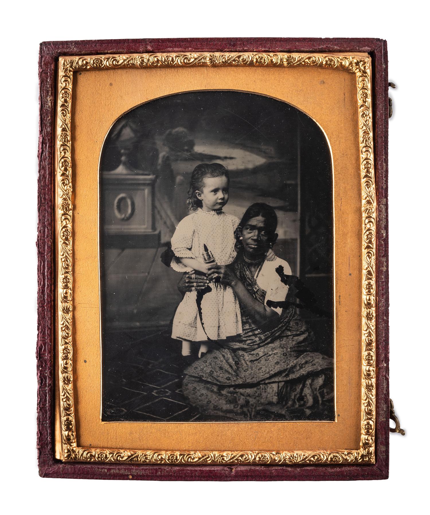 [EARLY PHOTOGRAPHY]. Quarter plate ambrotype featuring an Indian nanny with a white child. London: The London School of Photography, ca 1850s.