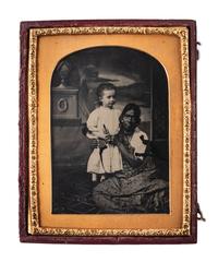 [EARLY PHOTOGRAPHY]. Quarter plate ambrotype featuring an Indian nanny with a white child. London: The London School of Photography, ca 1850s.