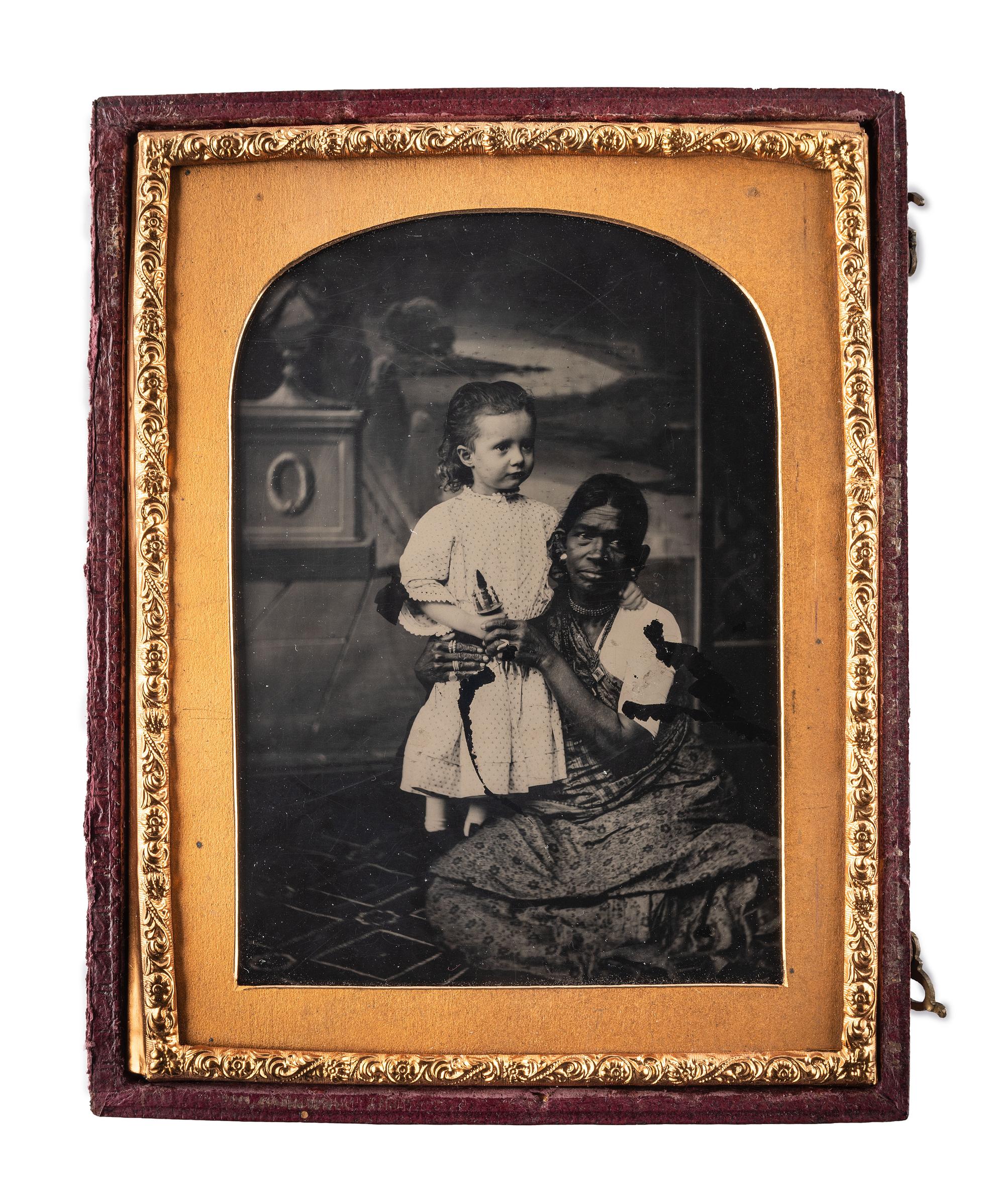 [EARLY PHOTOGRAPHY]. Quarter plate ambrotype featuring an Indian nanny with a white child. London: The London School of Photography, ca 1850s.