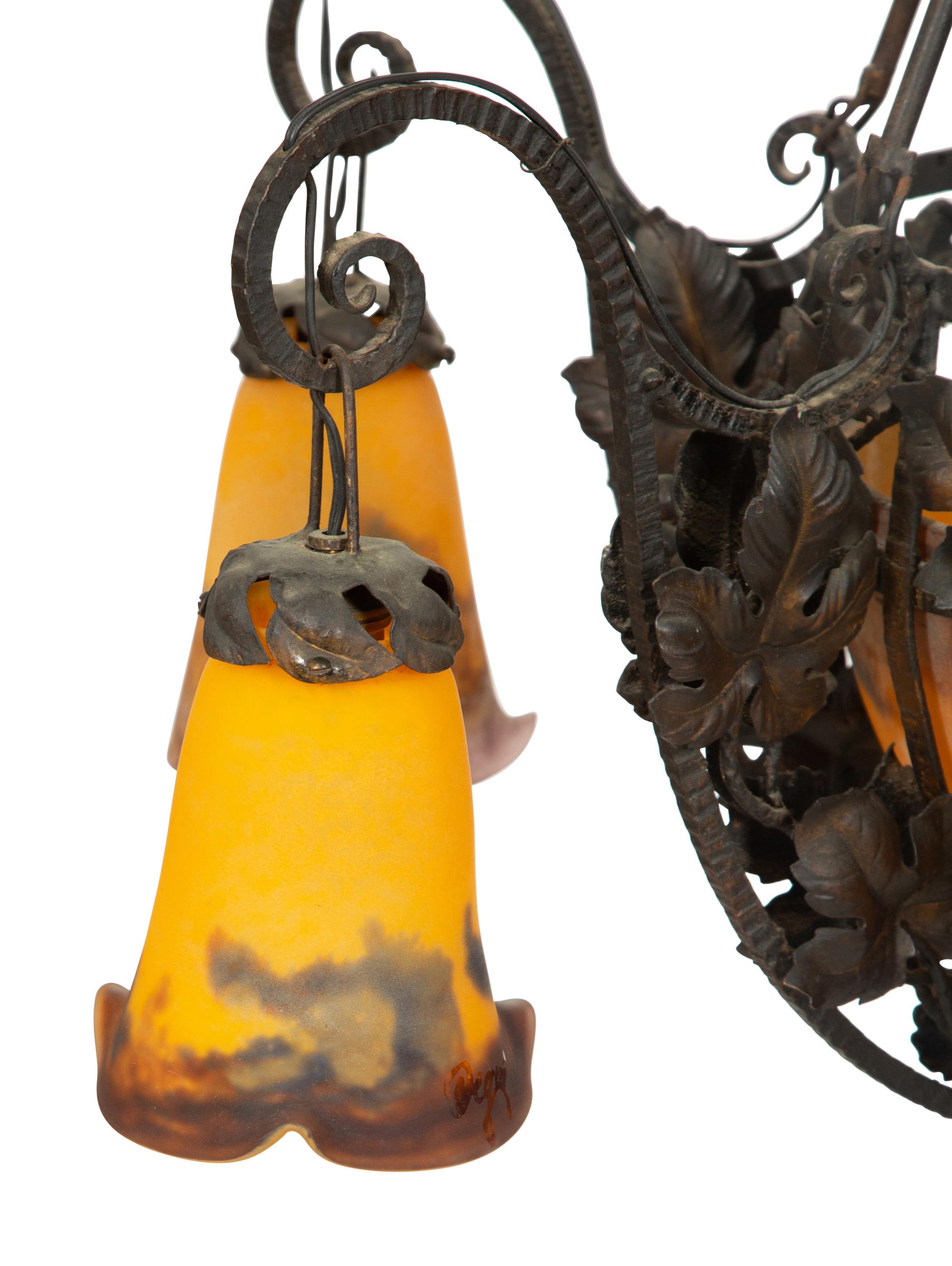 An Art Deco Wrought Iron and Glass Chandelier by Degue