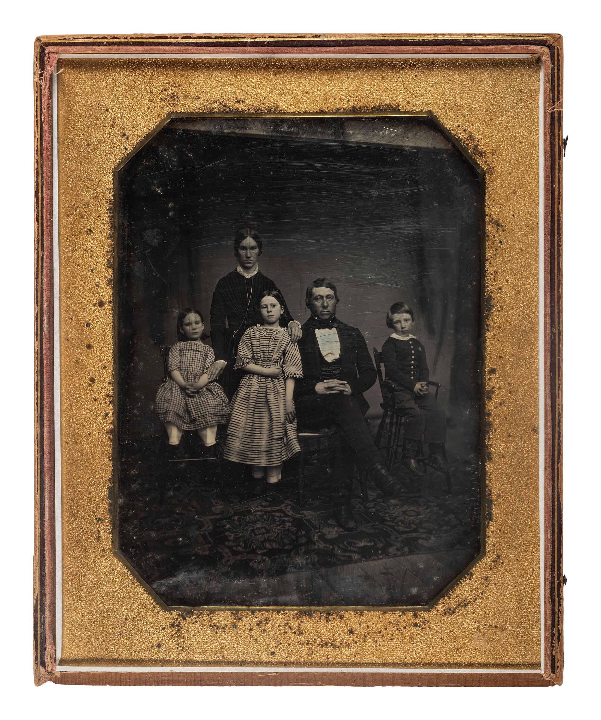 [EARLY PHOTOGRAPHY]. Whole plate daguerreotype of a family of five.