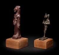An Egyptian Stone Striding Bastet and an Egyptian Bronze Anubis