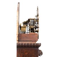 A Renaissance Revival Carved Oak Tall Case Clock