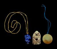 Three Chinese Jade and Hardstone Pendants