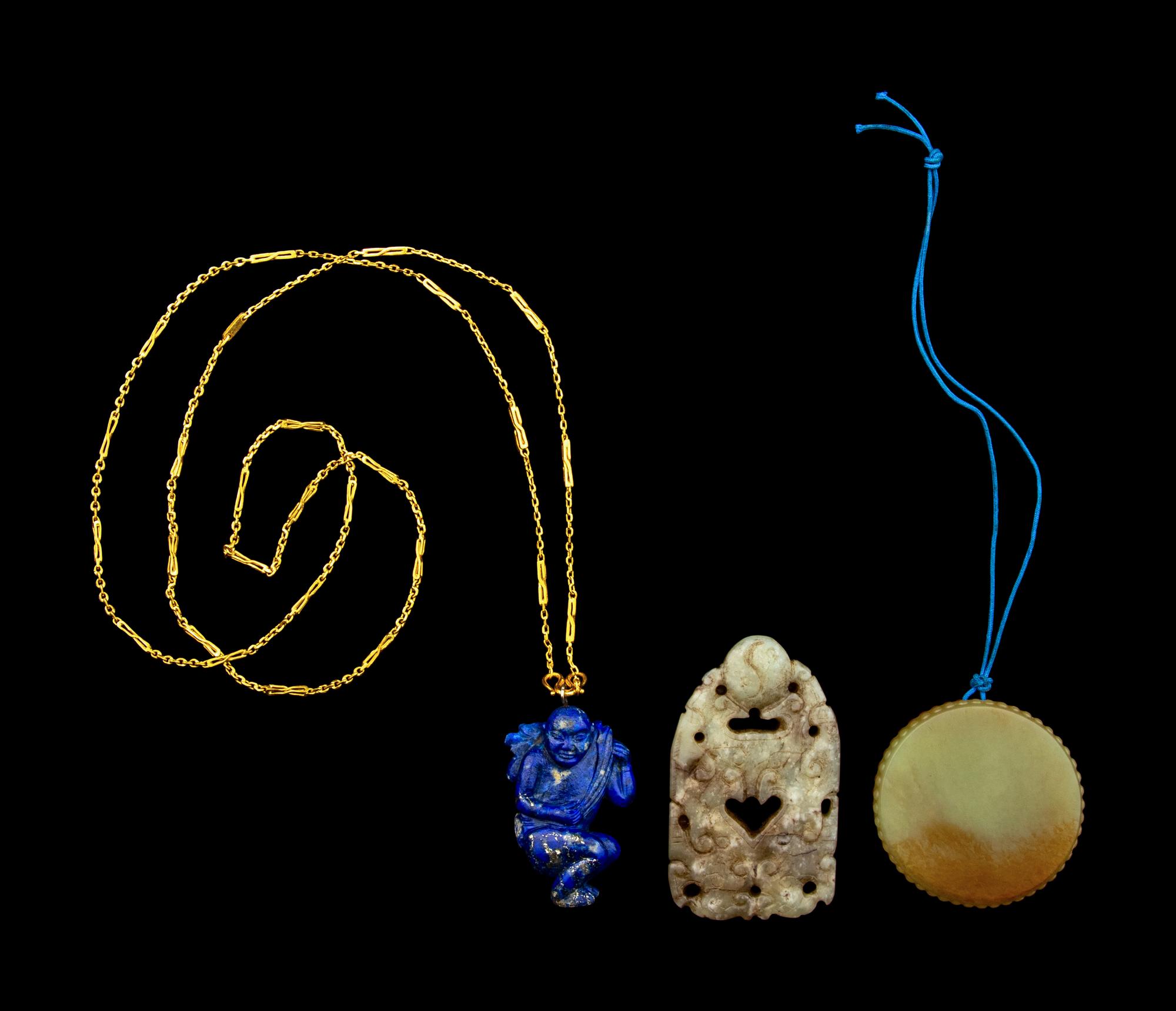 Three Chinese Jade and Hardstone Pendants