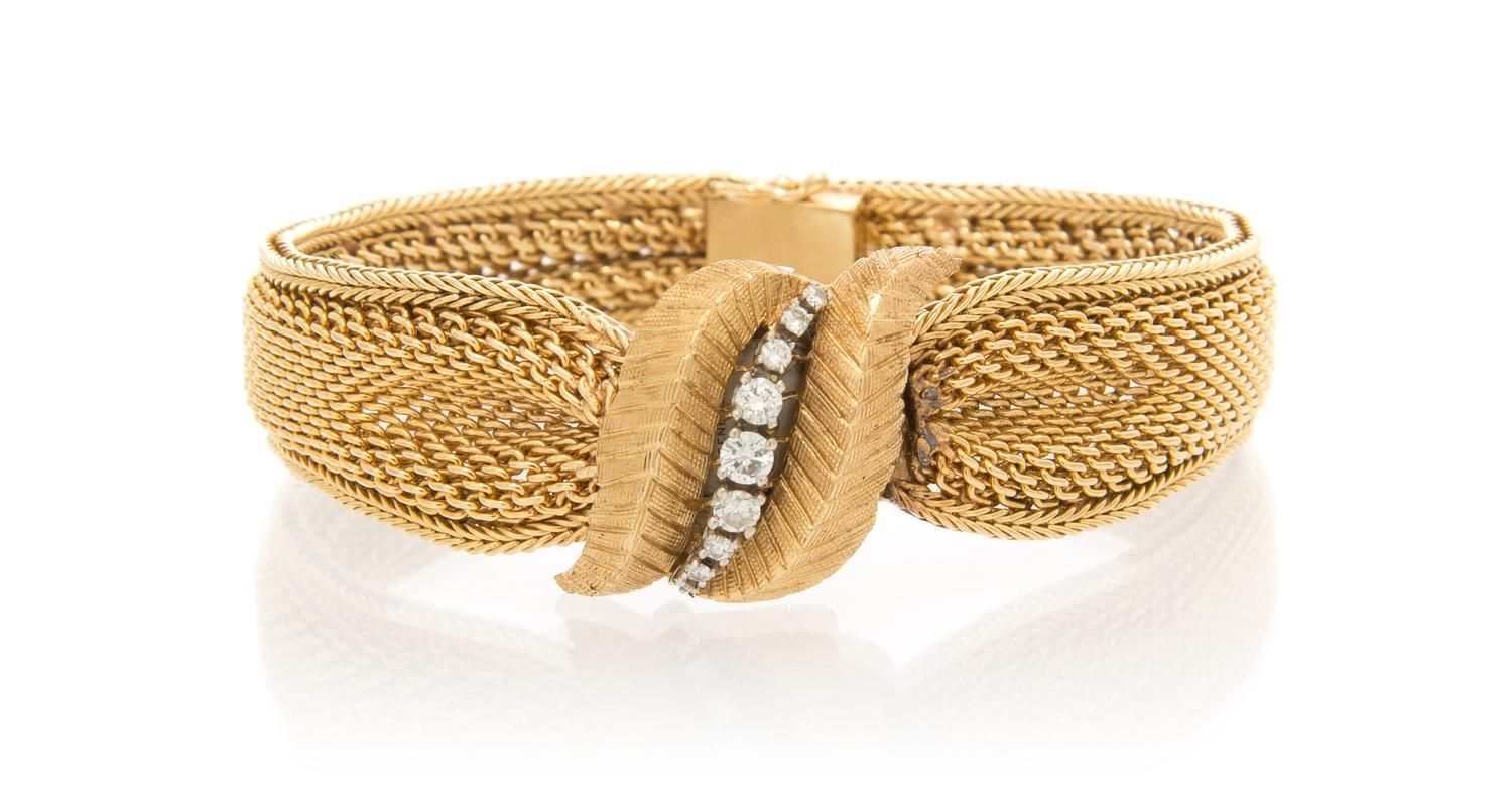 A 14 Karat Yellow Gold and Diamond Surprise Watch, Geneve, 34.80 dwts.