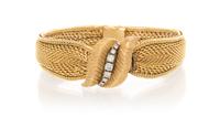A 14 Karat Yellow Gold and Diamond Surprise Watch, Geneve, 34.80 dwts.