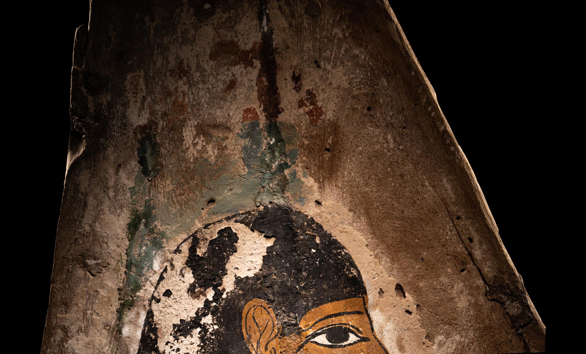 An Egyptian Polychrome Wood Fragment of a Sarcophagus with Isis