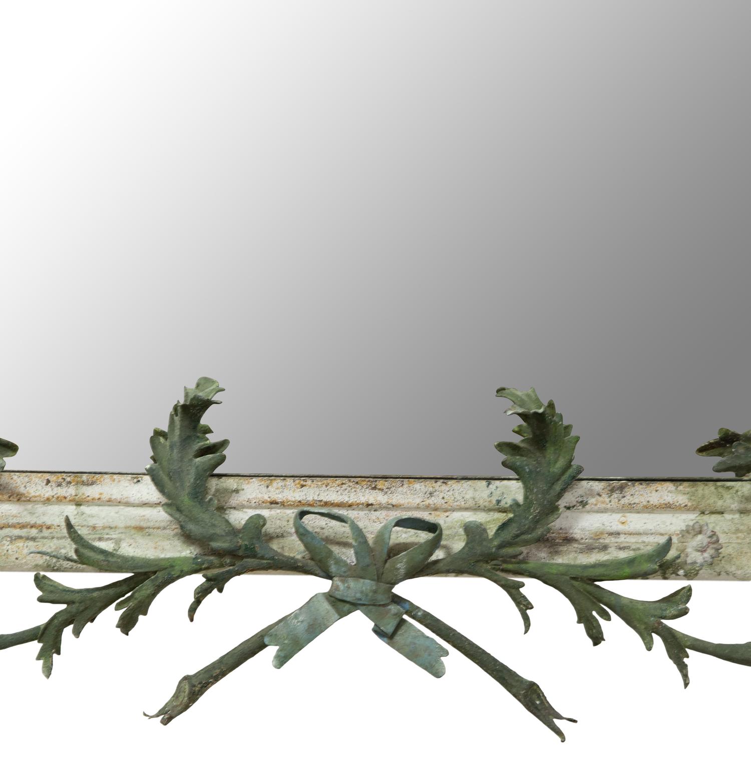A Green Tole Peinte Foliate Mounted Mirror