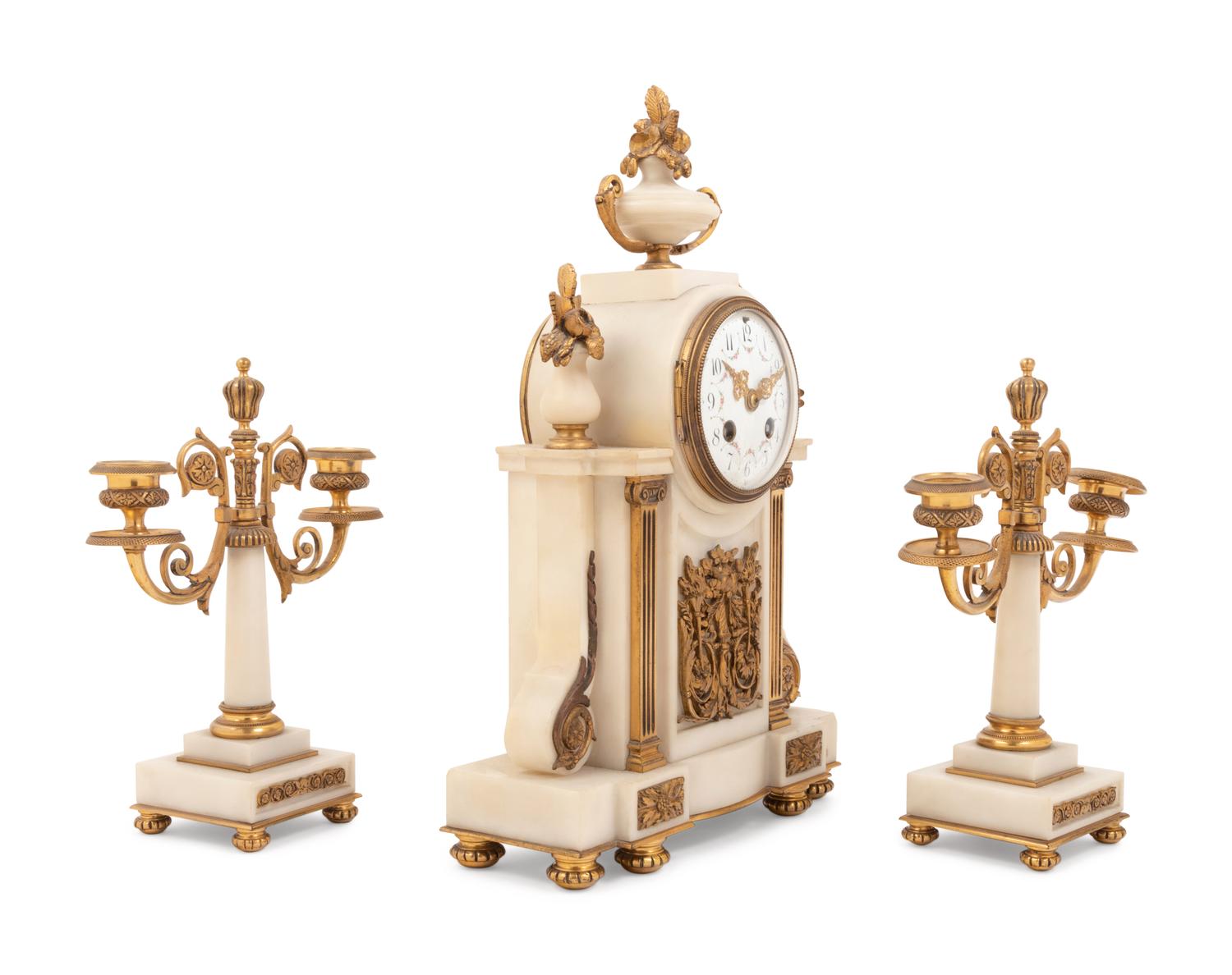 A Louis XVI Style Gilt Bronze Mounted Clock Garniture