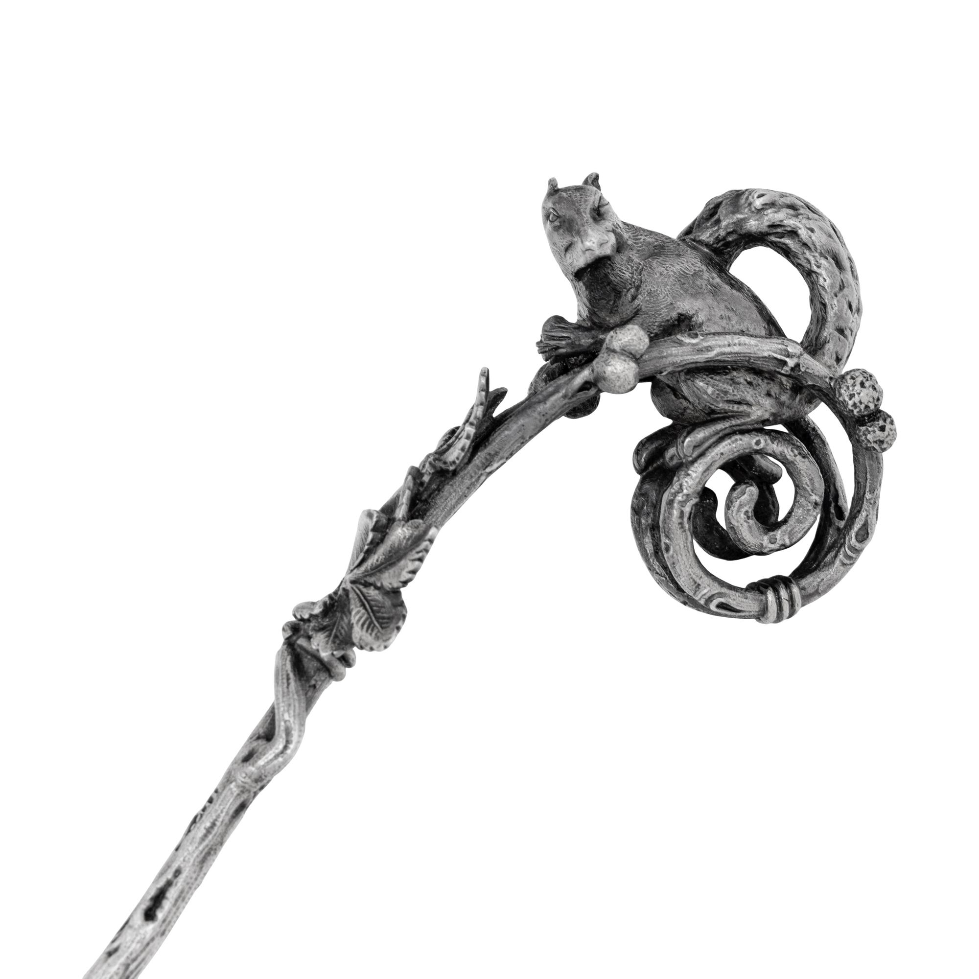 A Tiffany and Co. Silver Nut Scoop and Set of Six Nut Picks