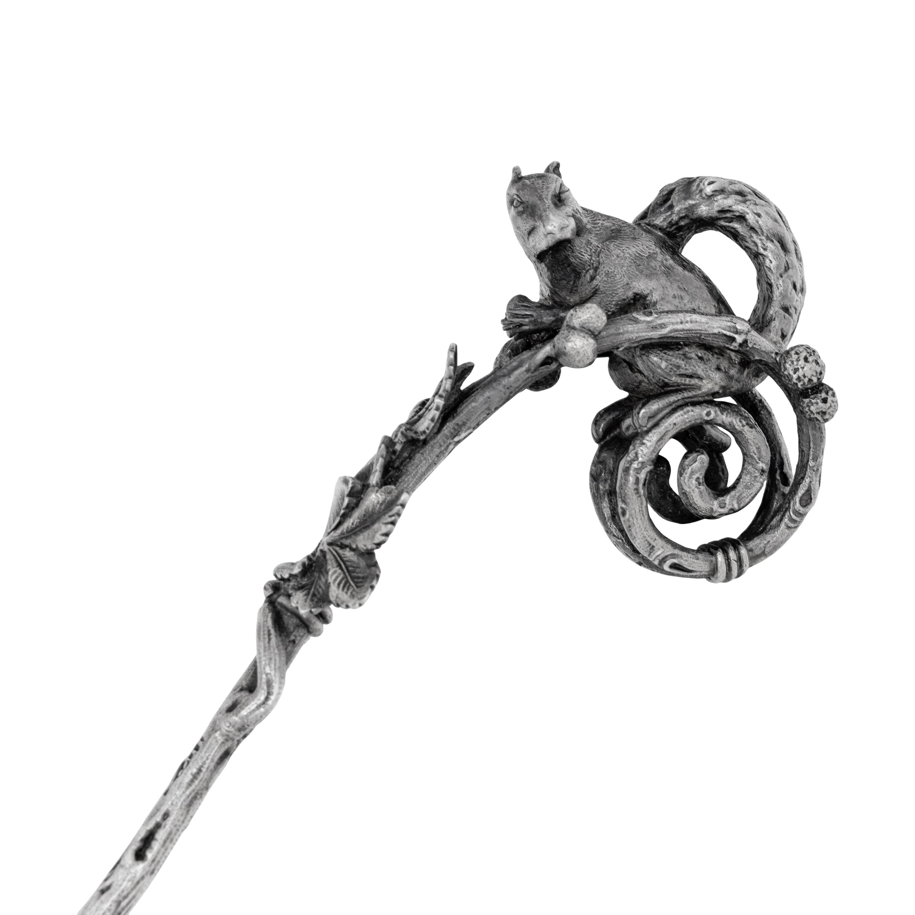 A Tiffany and Co. Silver Nut Scoop and Set of Six Nut Picks
