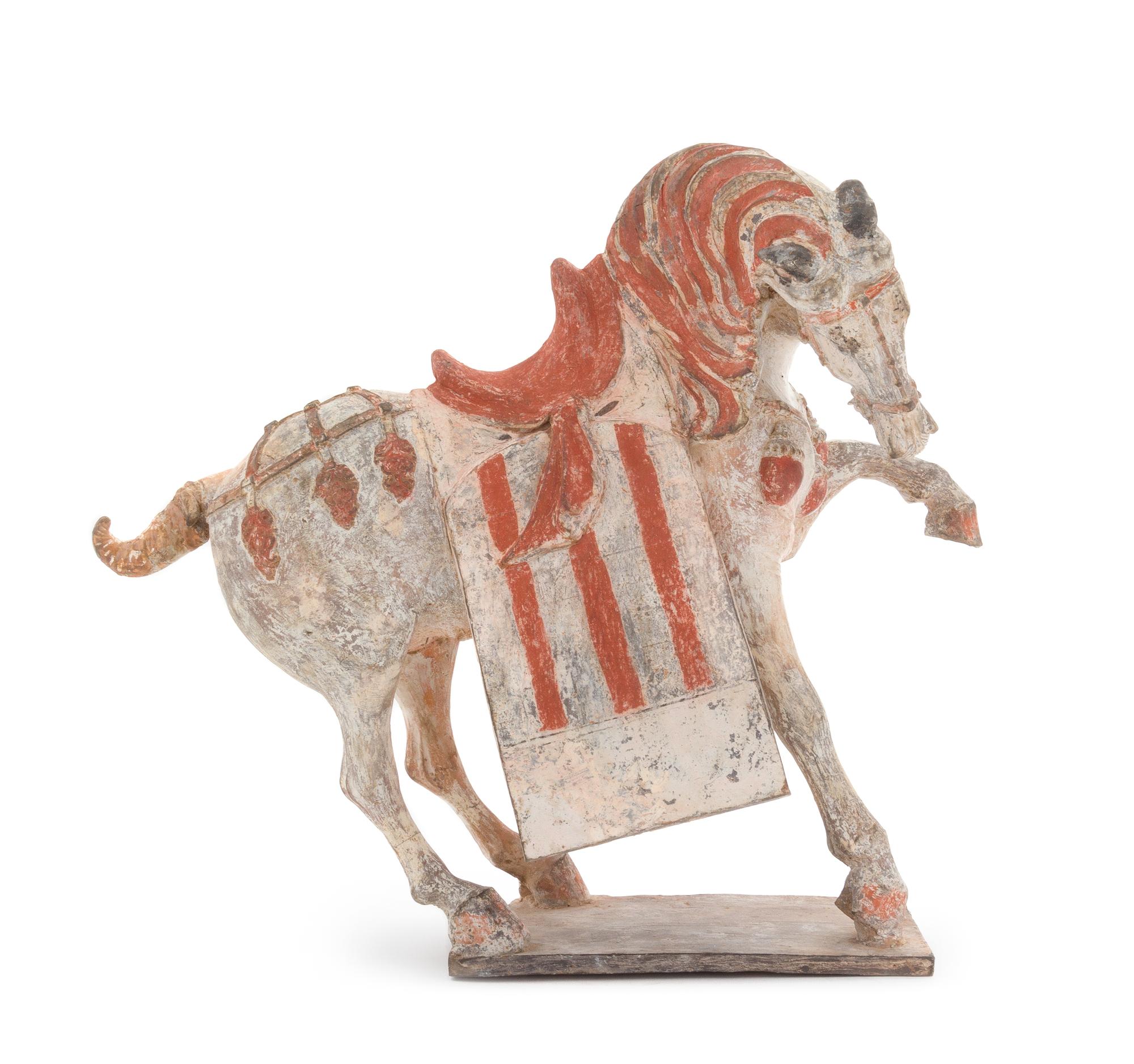 A Painted Pottery Figure of a Prancing Horse Height 12 1/2 inches. — POSSIBLY TANG DYNASTY