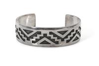 A Hopi Silver Overlay Bracelet, Bradley Gashwazra Length 6 3/8 x opening 1 1/4 x width 3/4 inches.