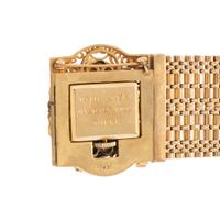 YELLOW GOLD, SEED PEARL, AND ENAMEL CONVERTIBLE SURPRISE WATCH