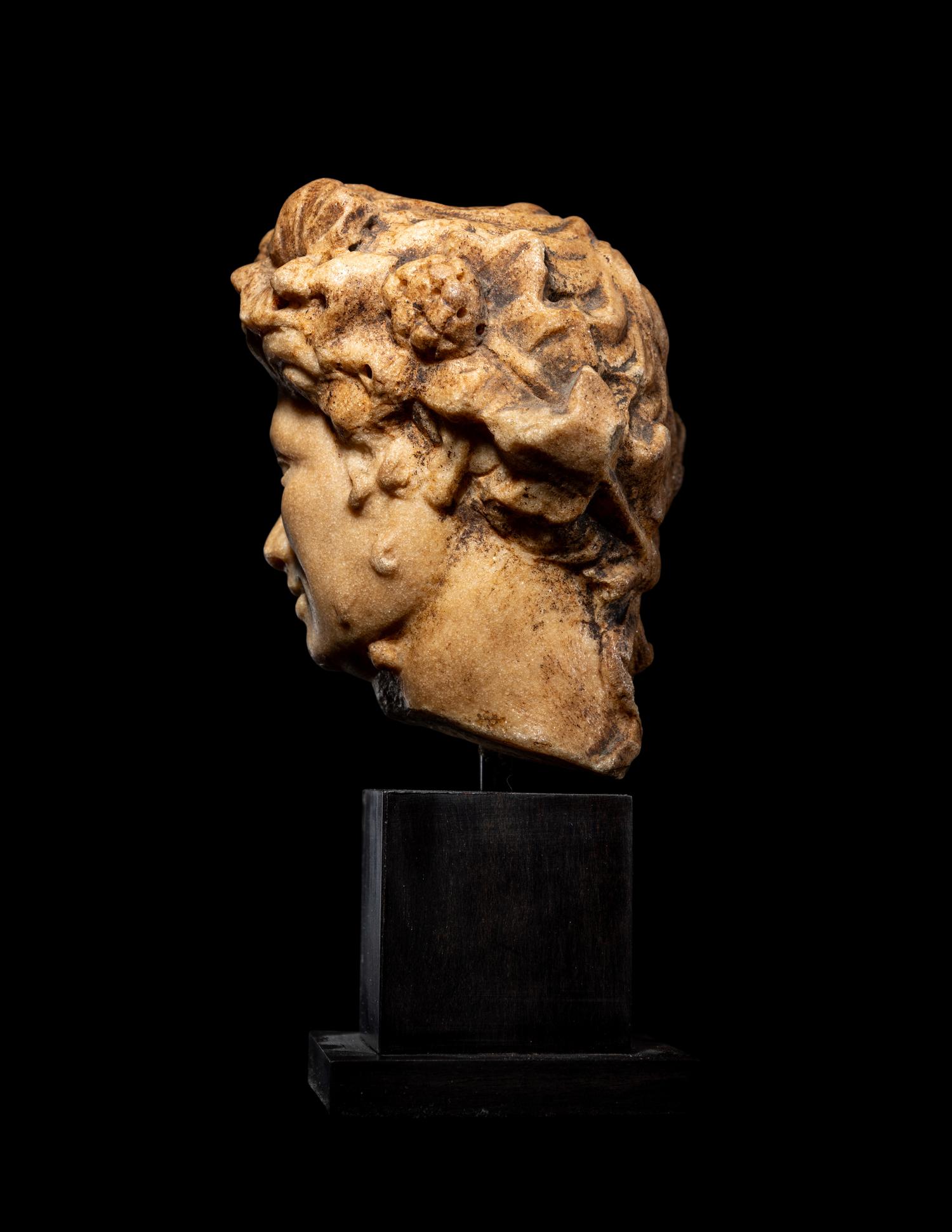 A Roman Marble Head of a Satyr
