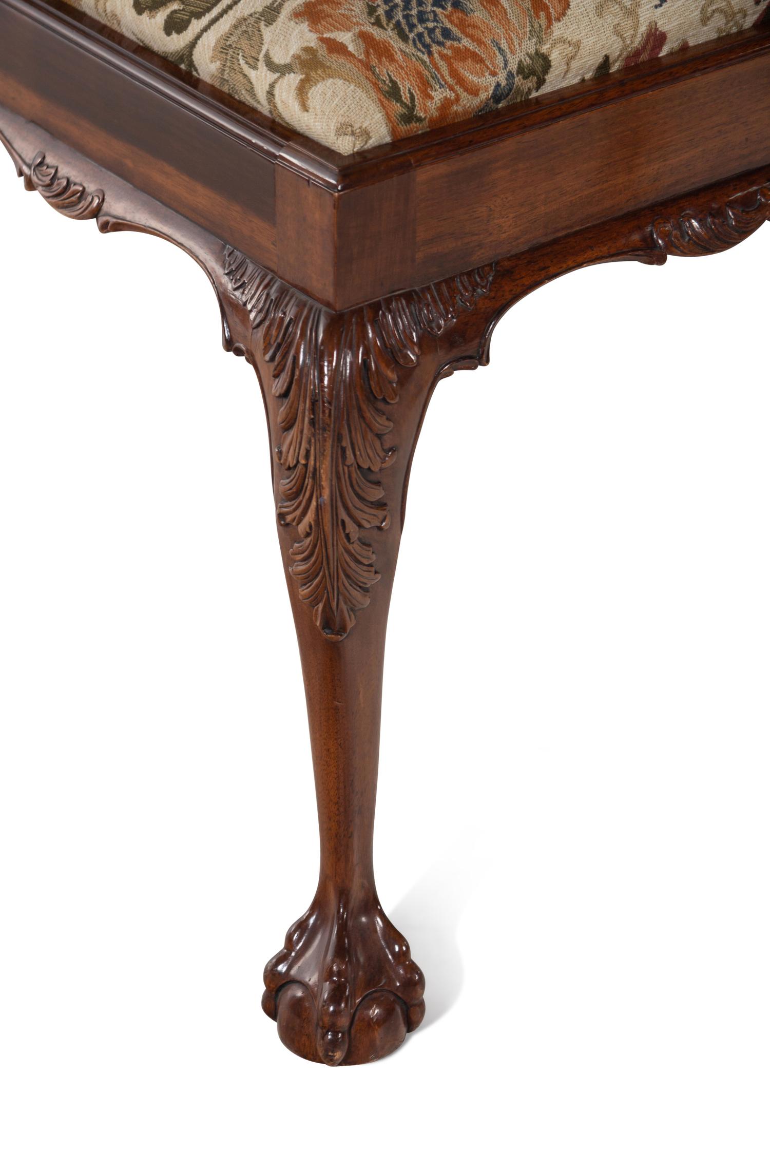 A Set of Twelve George II Style Carved Mahogany Dining Chairs