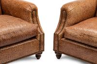 A Pair of Faux Ostrich Embossed Leather Upholstered Club Chairs