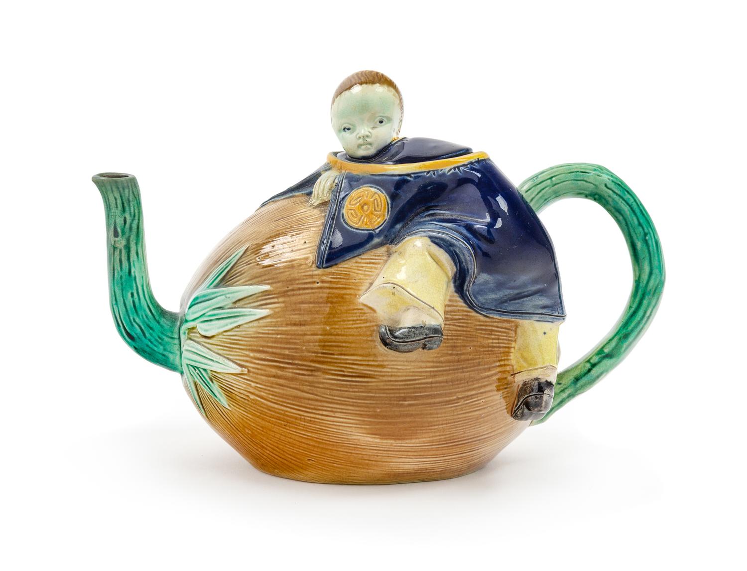 A Minton Majolica Figural Teapot Height 5 1/4 x width 7 1/2 inches. — CIRCA 1870