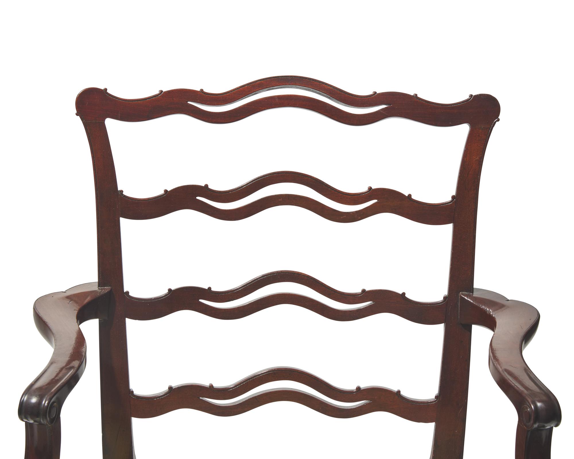 A pair of George III ribbon-back mahogany armchairs, late 18th / 19th century
