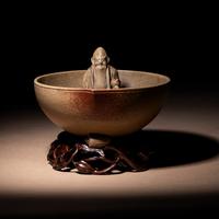 A Rare Yixing Peach-Form 'Figure' Puzzle Cup with Impressed Seals 'Chen', 'Mingyuan' and Wood Stand 陳鳴遠款醉翁桃形公道杯