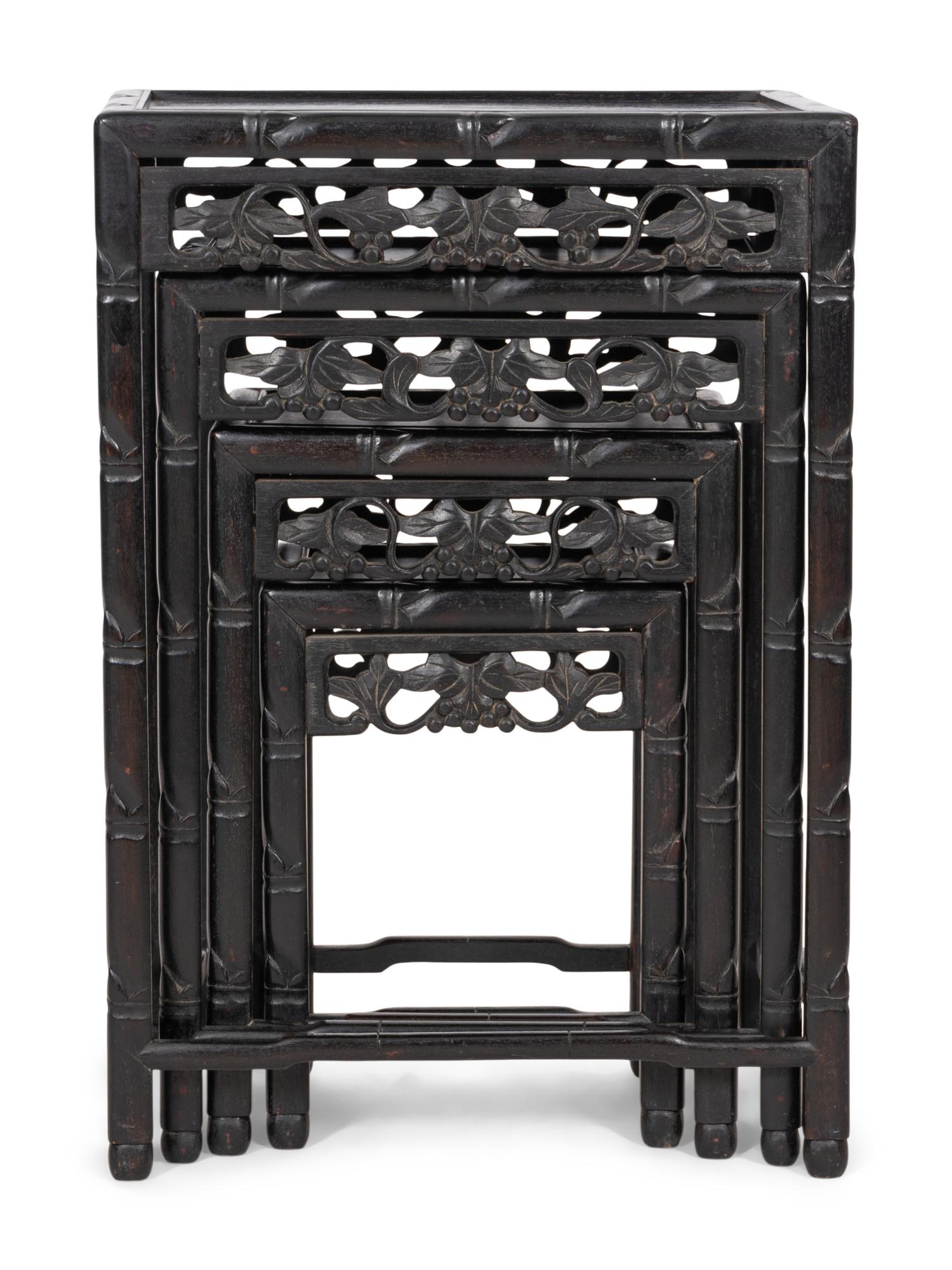 A Set of Four Chinese Ebonized Carved Teak Nesting Tables