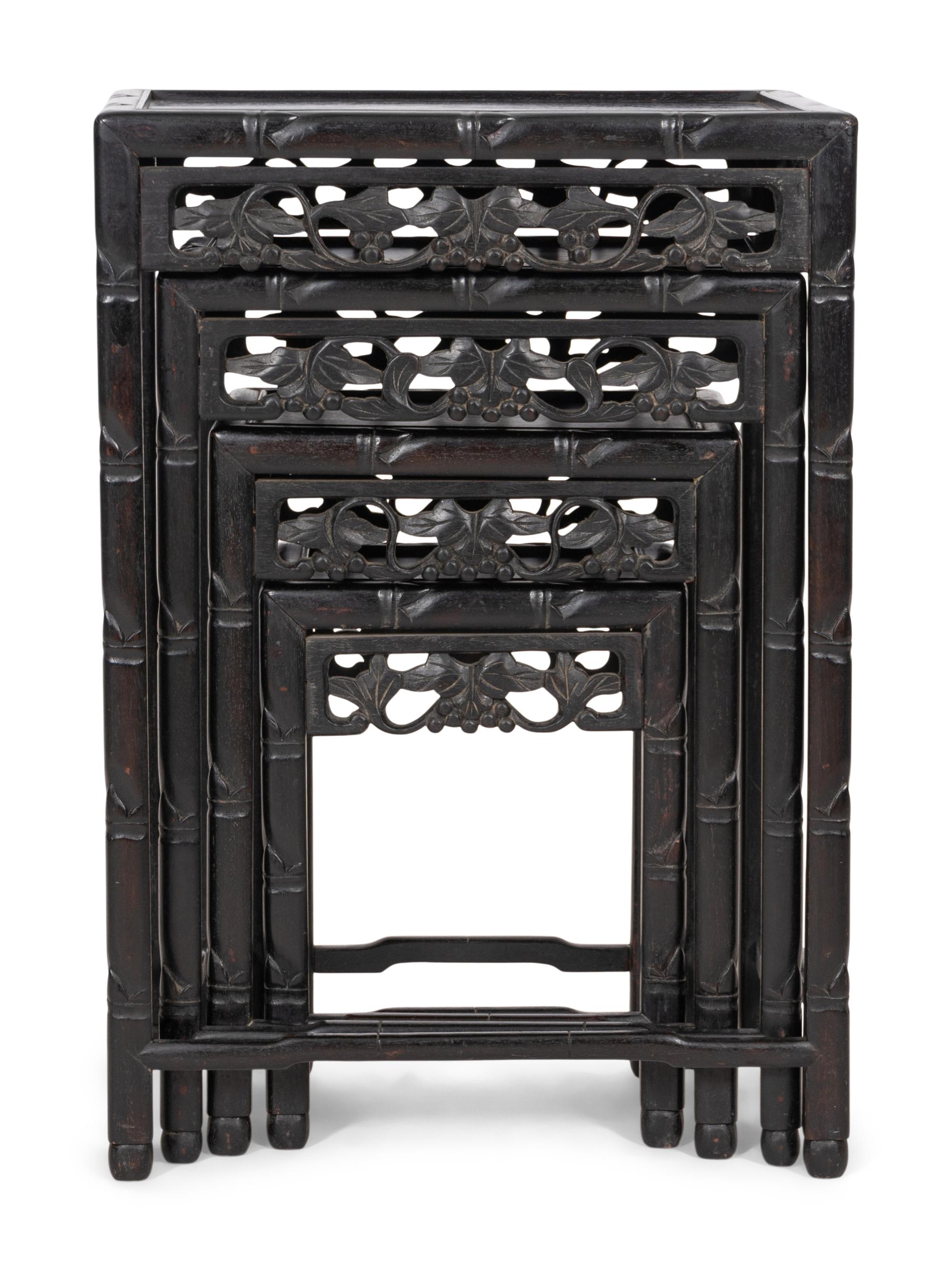 A Set of Four Chinese Ebonized Carved Teak Nesting Tables