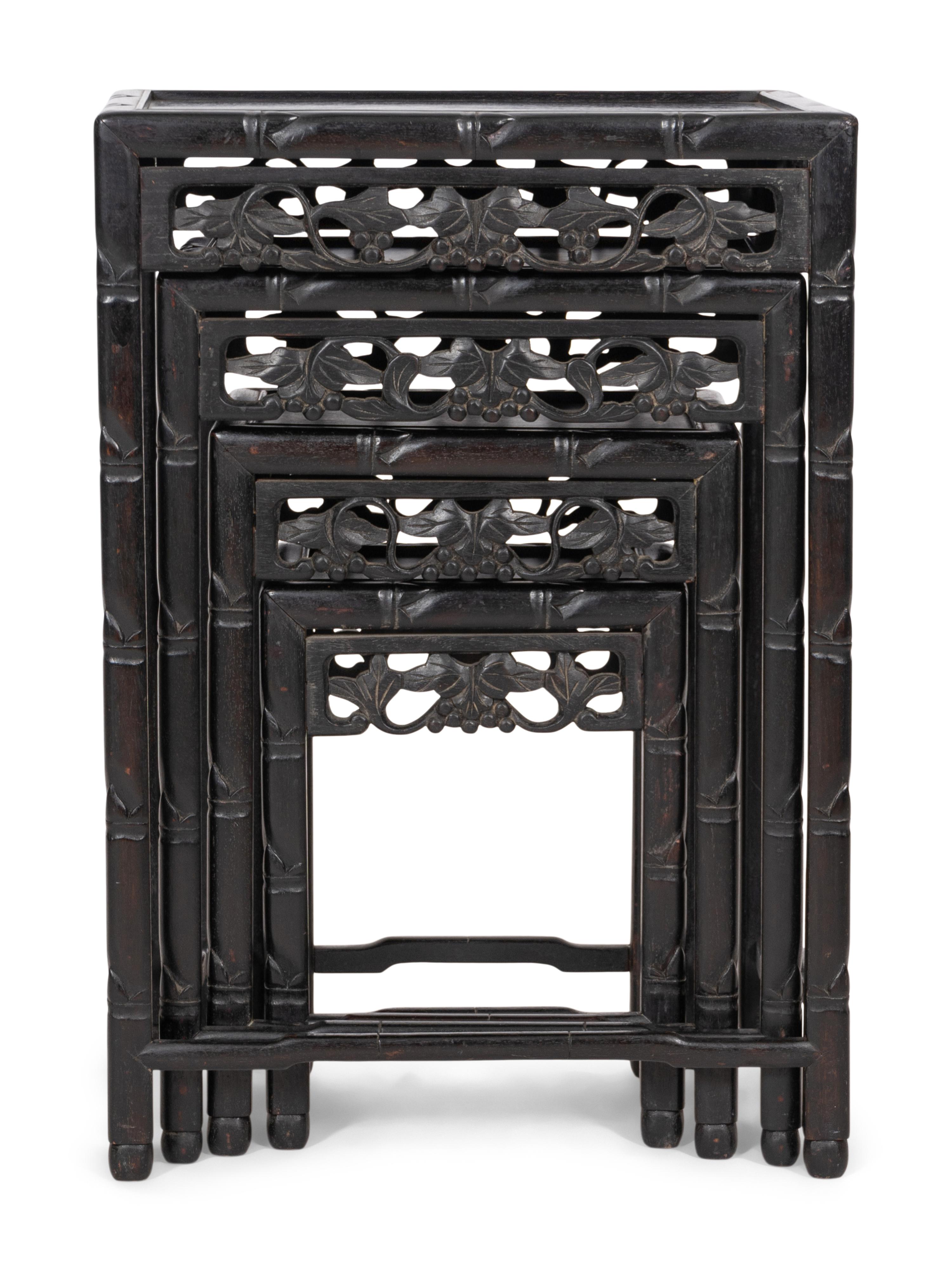A Set of Four Chinese Ebonized Carved Teak Nesting Tables