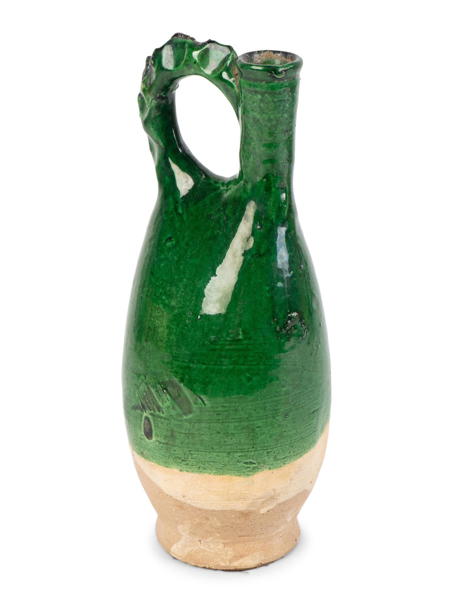 A Chinese Green-Glazed Pottery Cockscomb Ewer — LIAO DYNASTY