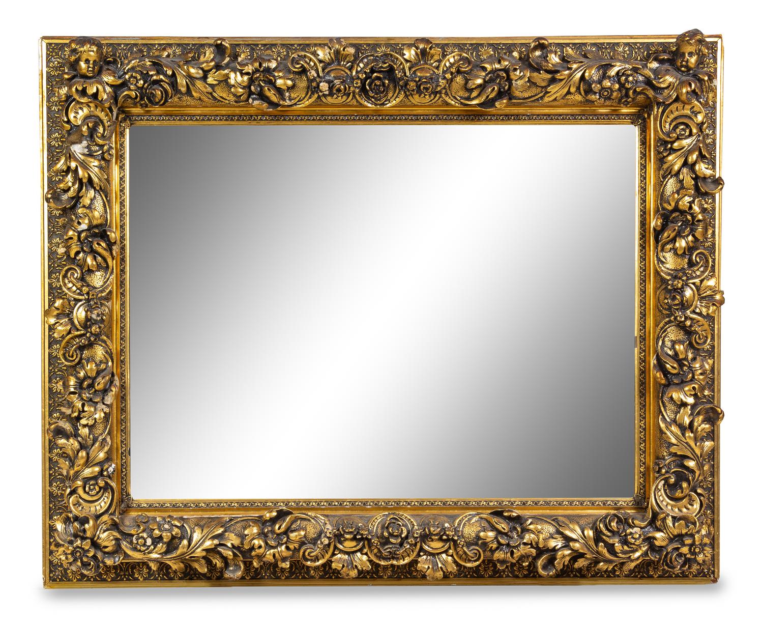 A Continental Carved Giltwood Mirror