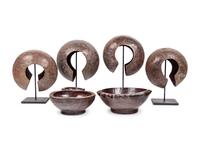 A Pair of Philippine Carved Wood Bowls and Four African Bronze Currency Bracelets on Metal Stands