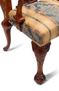 A Set of Sixteen George III Style Carved Walnut Dining Chairs