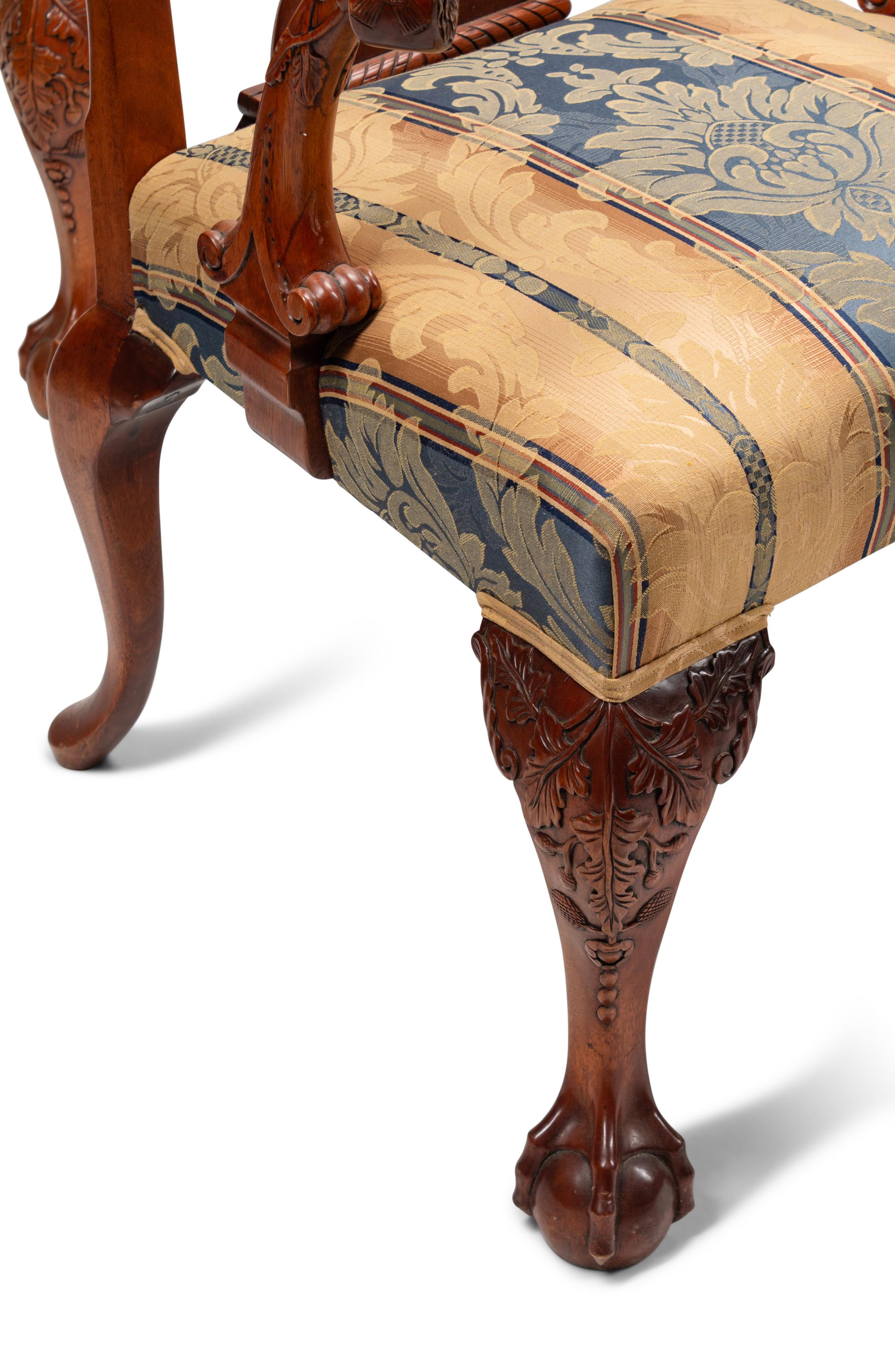 A Set of Sixteen George III Style Carved Walnut Dining Chairs