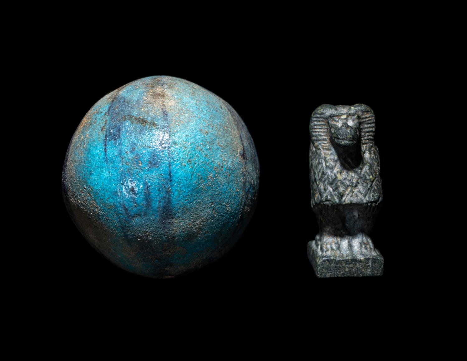 An Egyptian Steatite Baboon and a Bichrome Faience Ball Bead