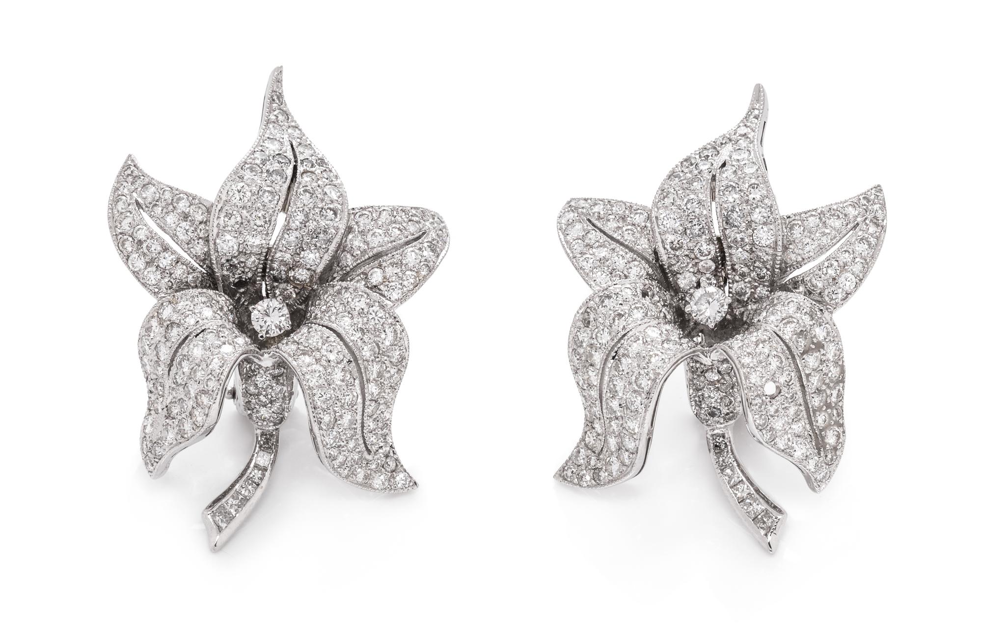 A Pair of 18 Karat White Gold and Diamond Flower Earclips, French,