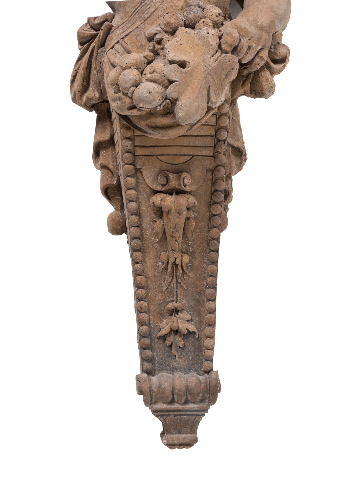 A Pair of French Cast Stone Consoles d'Appliqué with Stone Tops