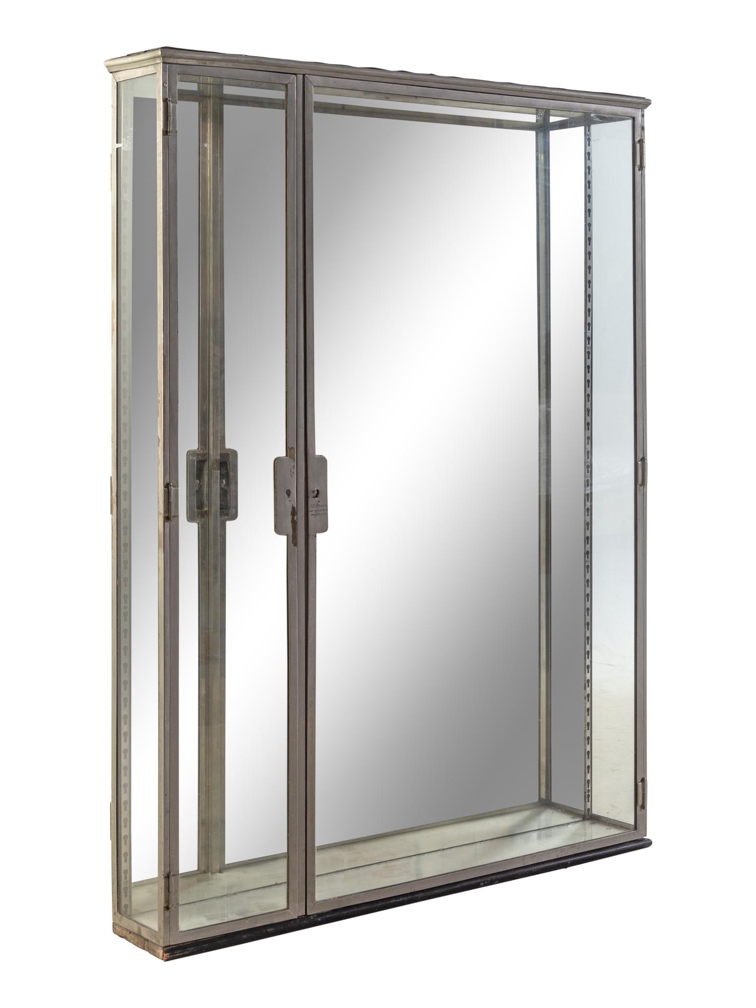A Belgian Steel and Glass Pharmacy Case with Adjustable Glass Shelves