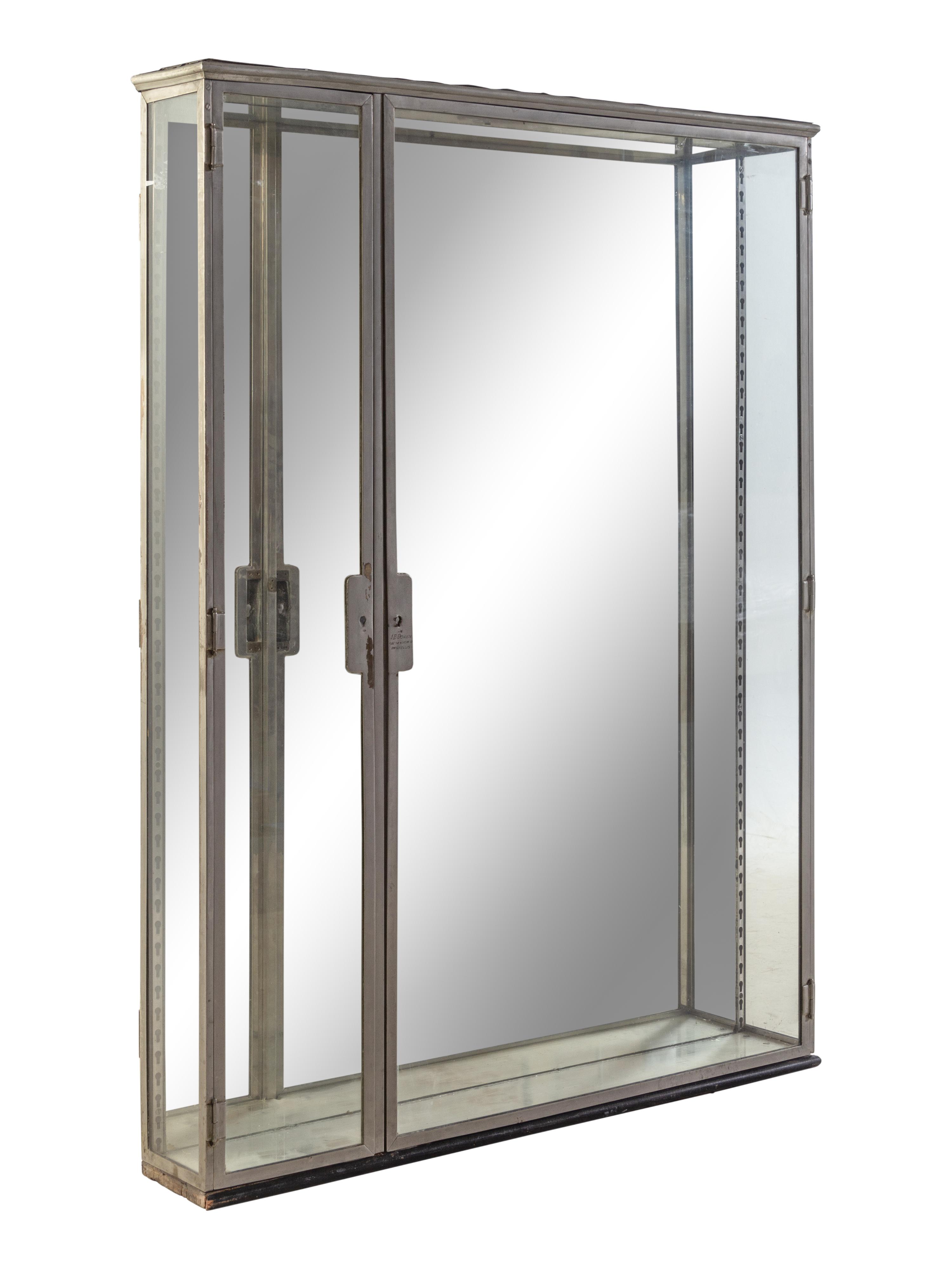A Belgian Steel and Glass Pharmacy Case with Adjustable Glass Shelves