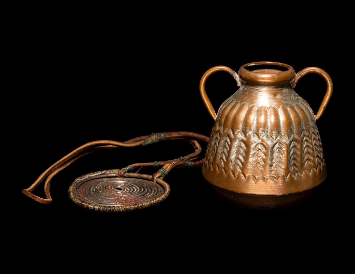 An African Metalwork Pendant and Copper Jar
