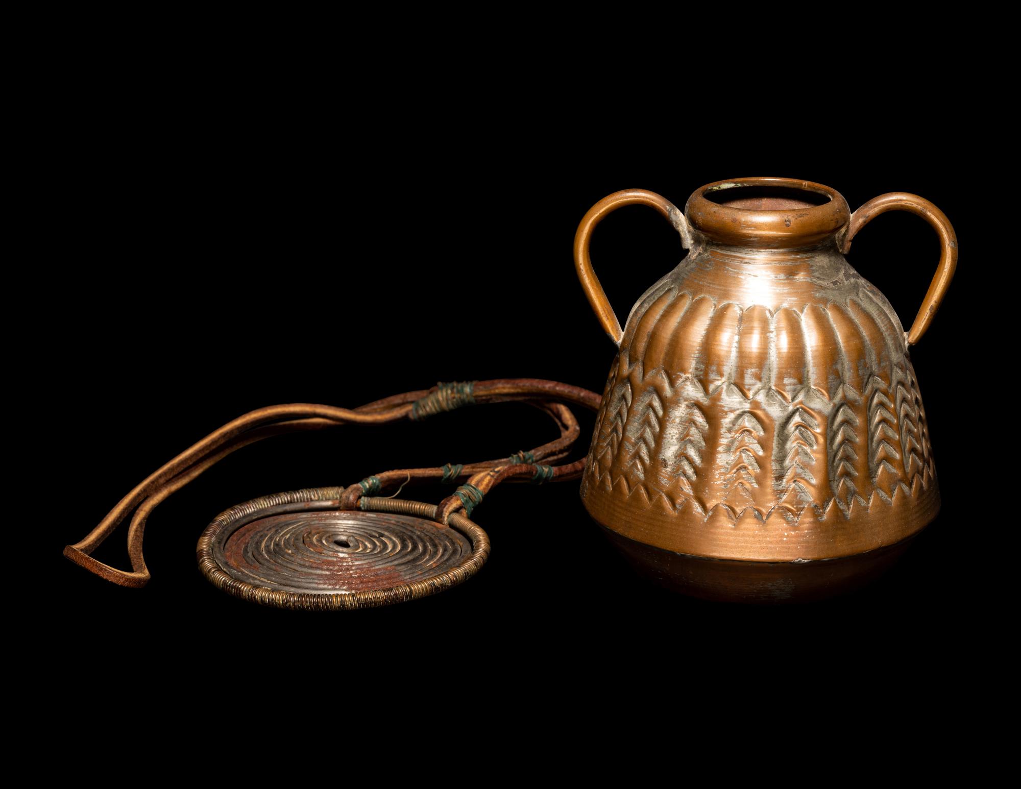 An African Metalwork Pendant and Copper Jar