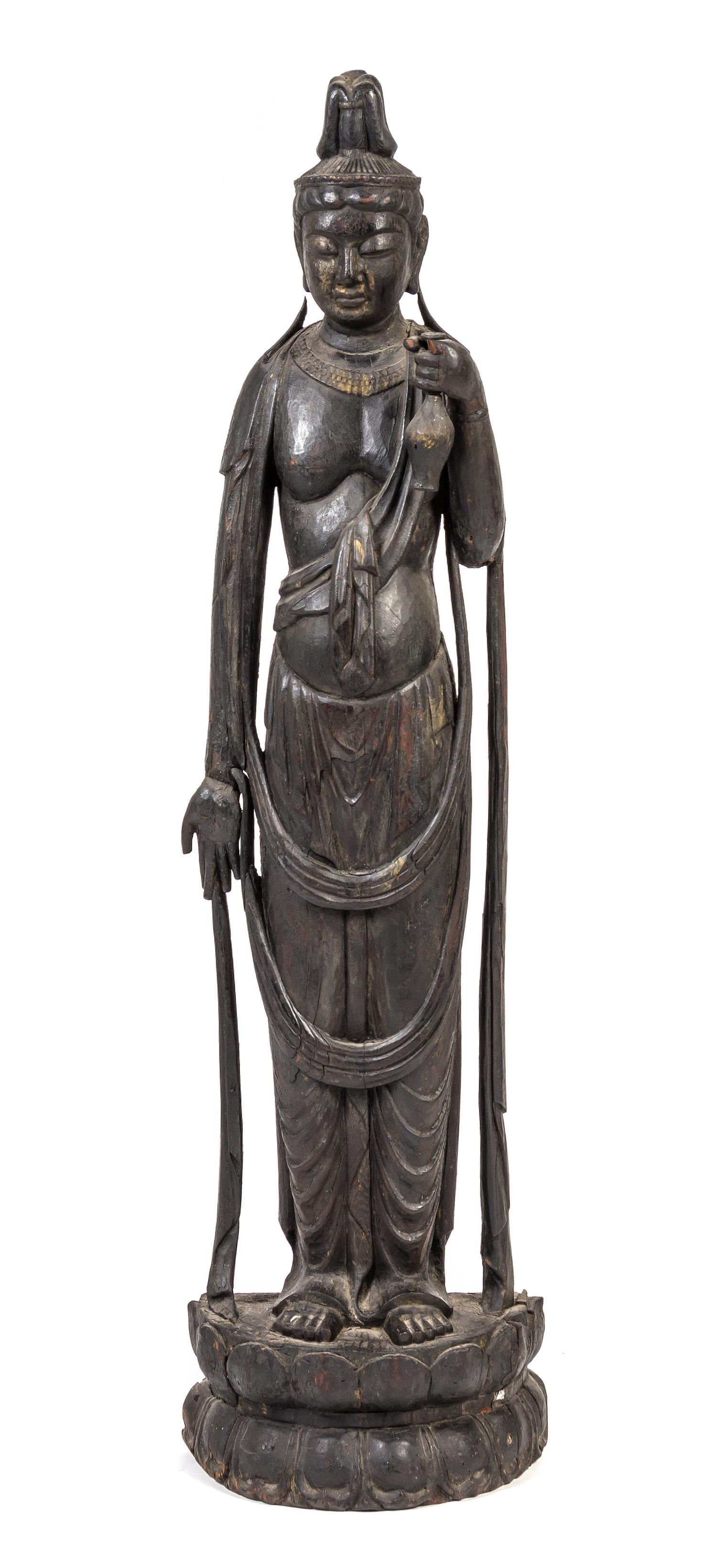 A Japanese Carved Wood Figure of Kannon Height overall 52 inches.