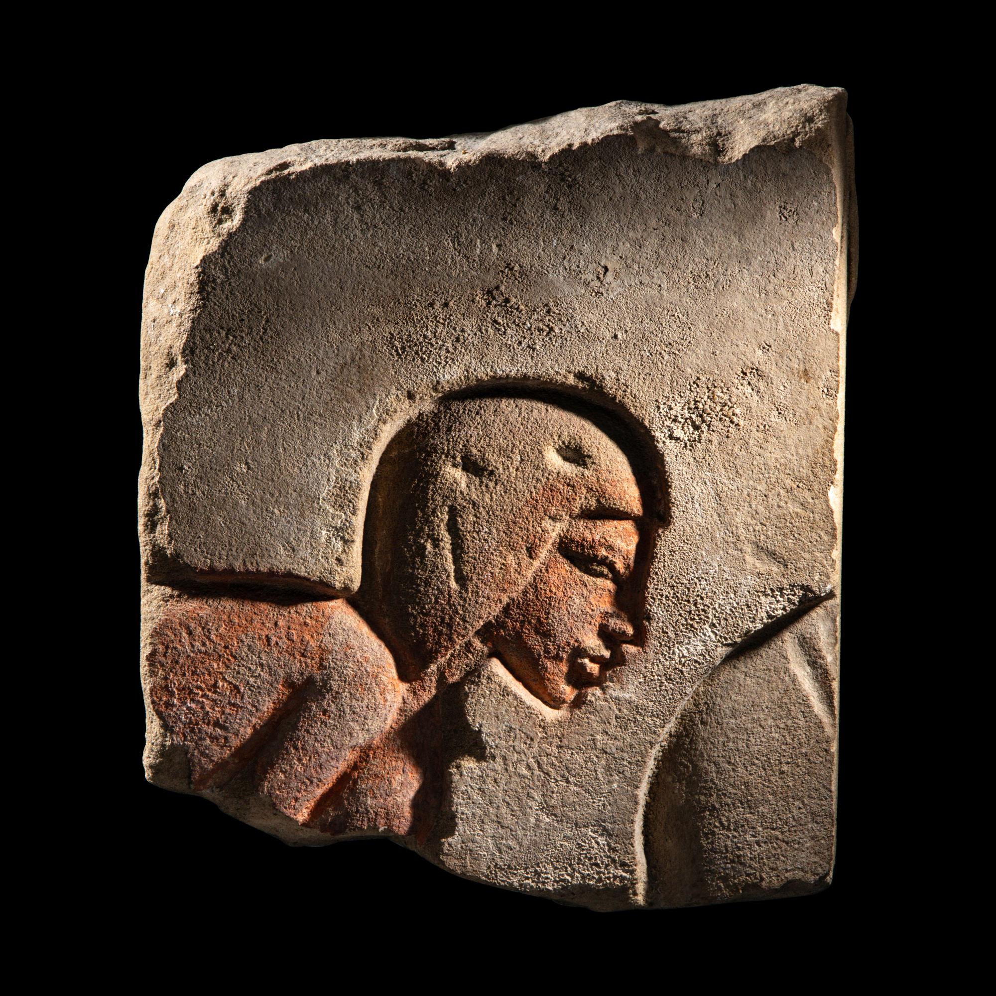 An Egyptian Sandstone Relief Fragment with a Worshipper