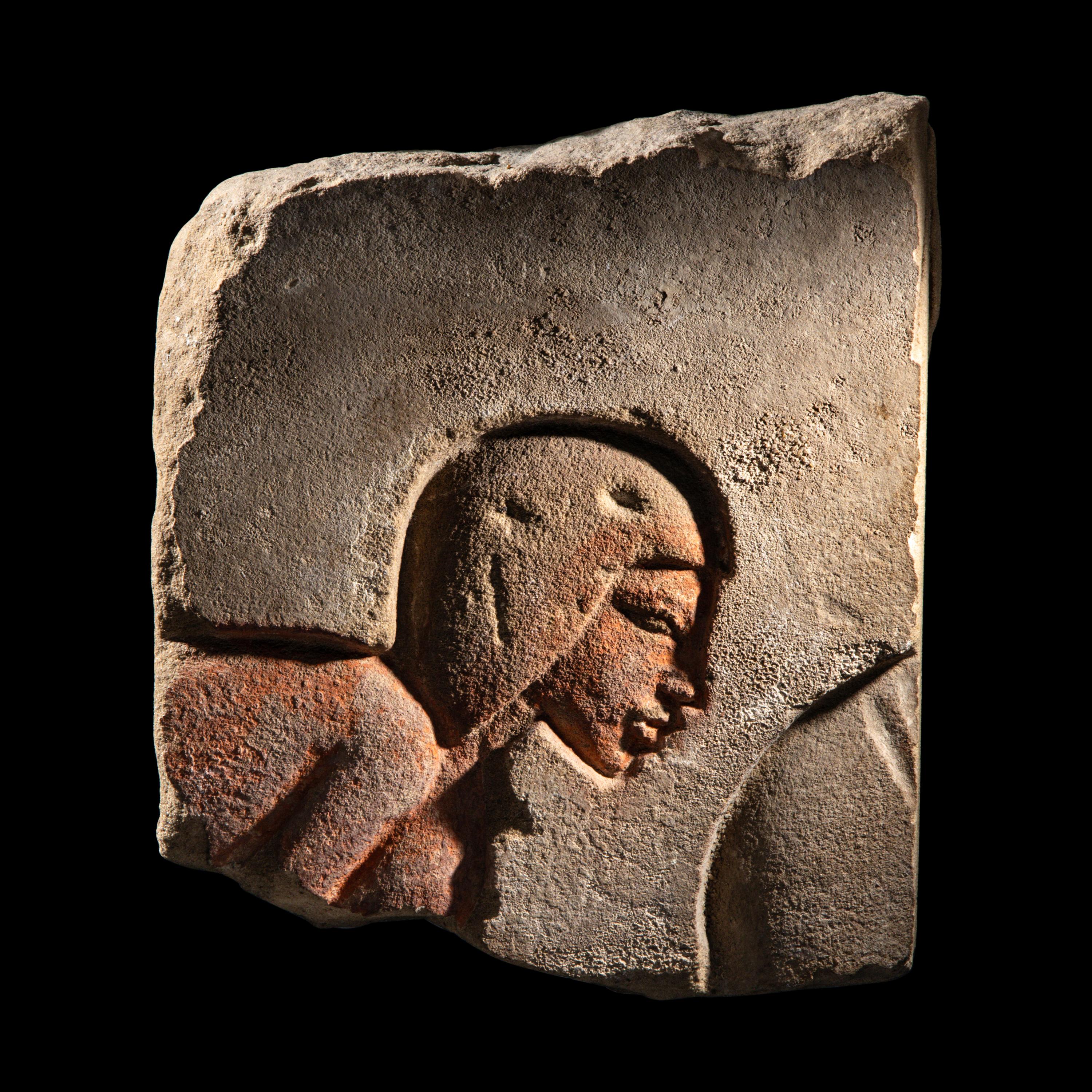 An Egyptian Sandstone Relief Fragment with a Worshipper