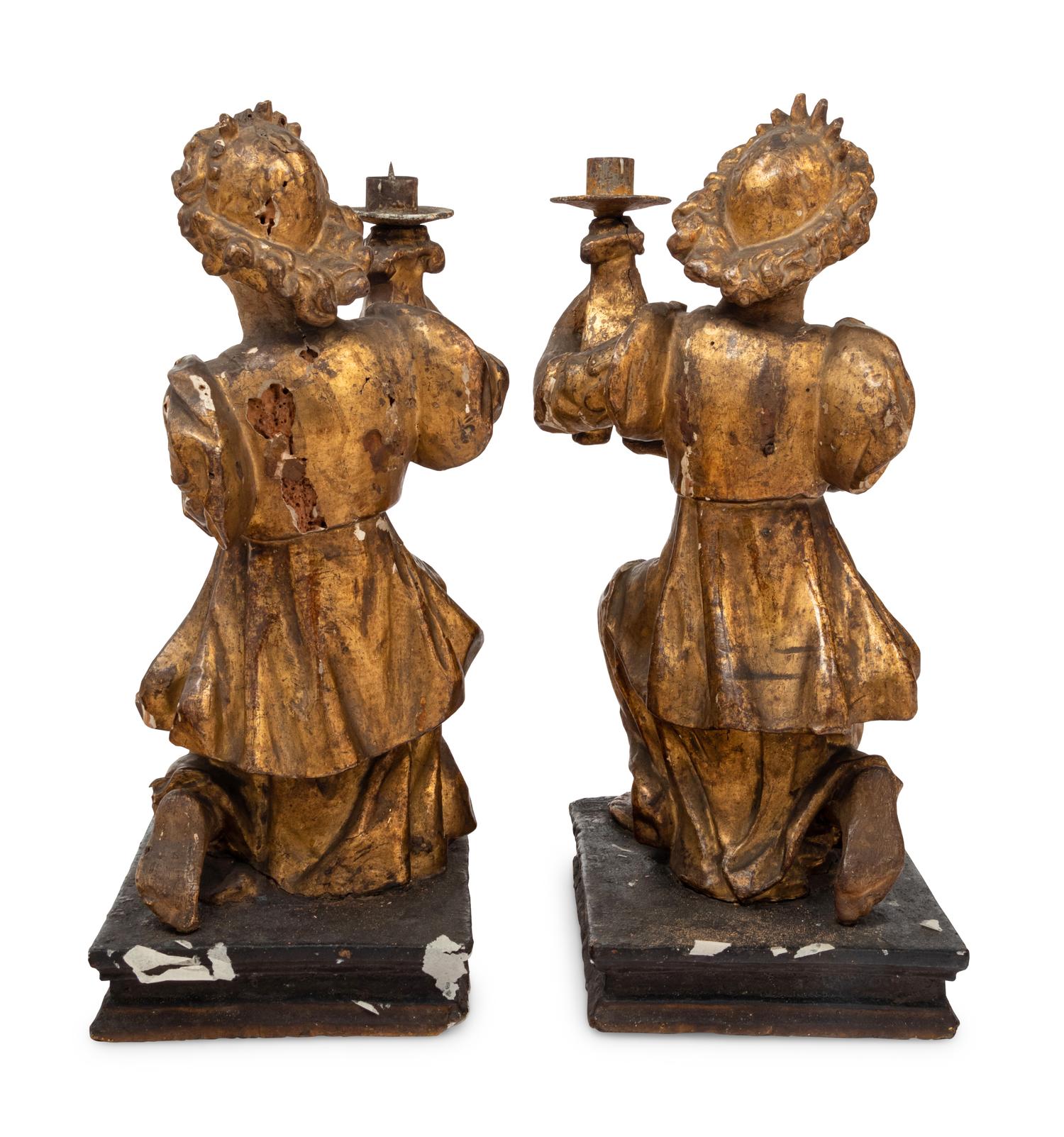 A Pair of Continental Giltwood Figural Altar Candlesticks
