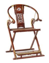 A Huanghuali Horseshoeback Folding Chair, Jiaoyi Height 43 3/4 x length 29 1/4 x width 19 inches. — 18TH/19TH CENTURY