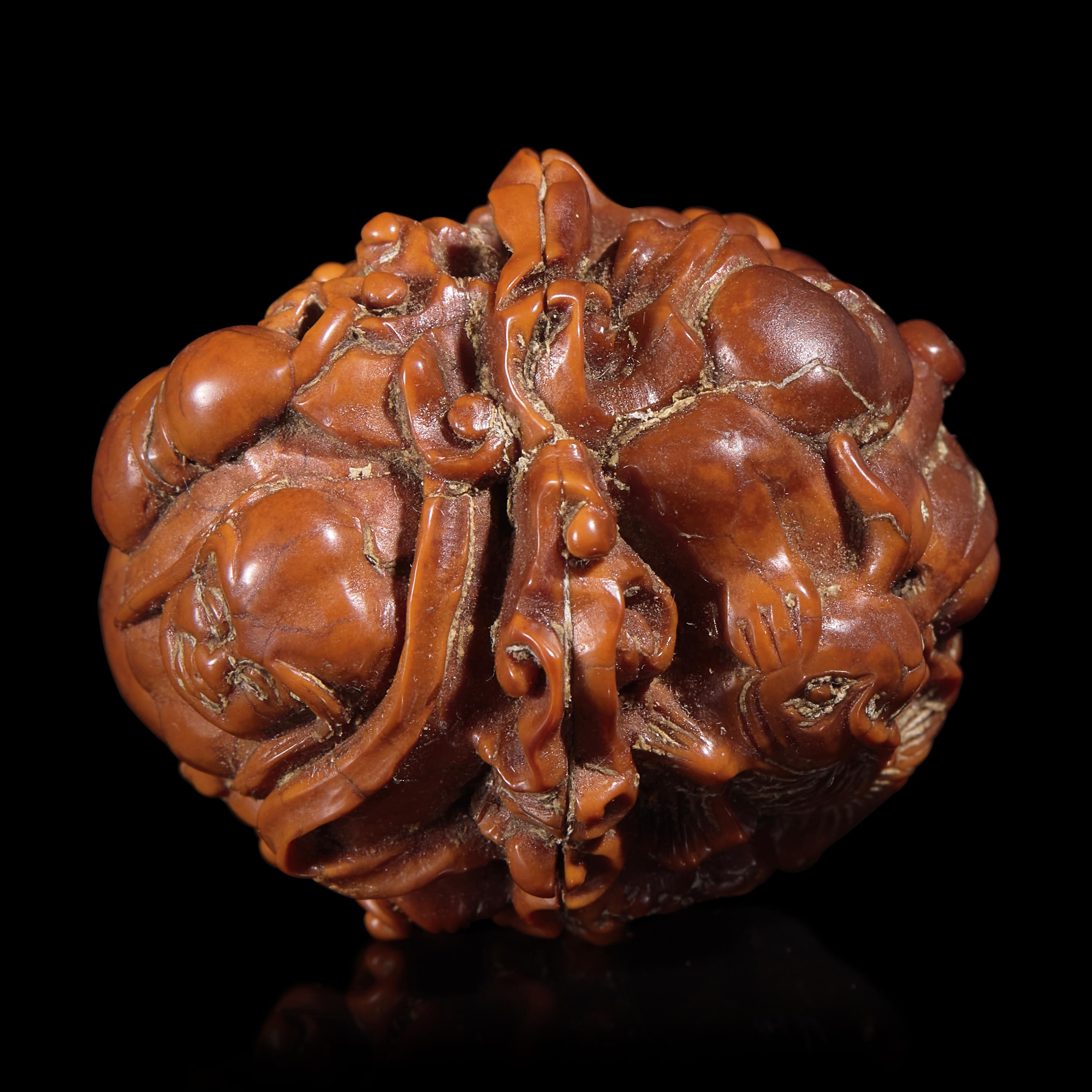 A Chinese Carved Luohan Walnut, 19th/Early 20th Century — 晚清/民國 羅漢圖文玩核桃