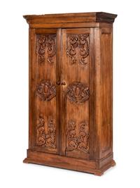 A Mexican Carved Walnut Wardrobe Cabinet