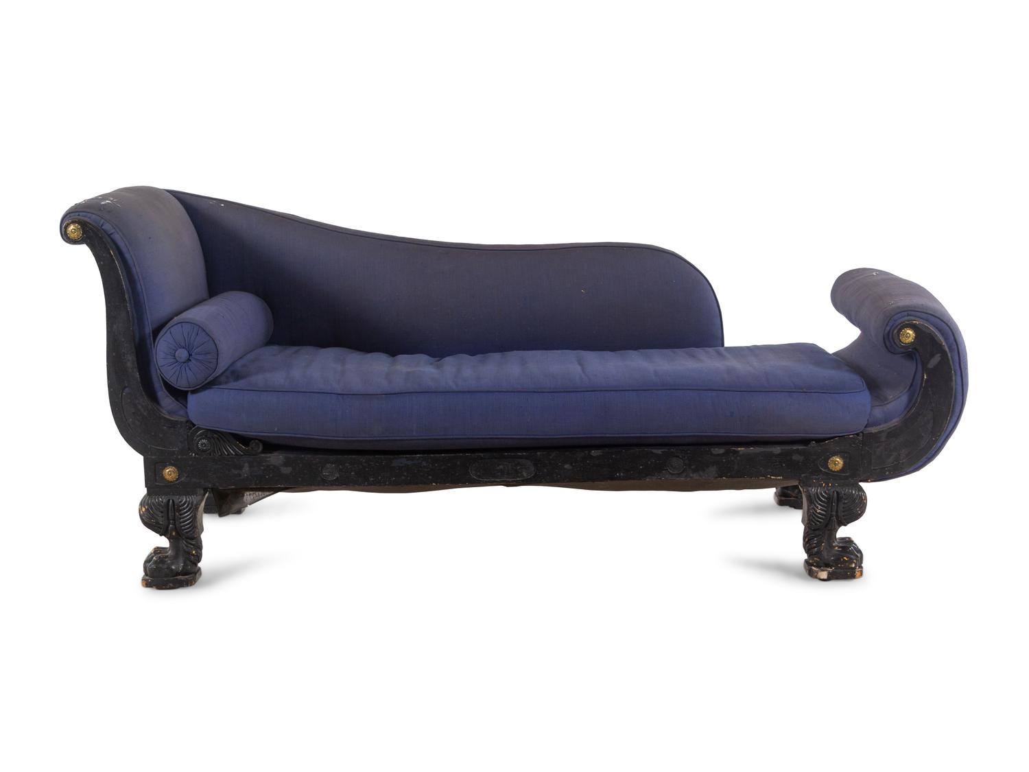 An Empire Style Gilt Metal Mounted Ebonized Chaise Longue