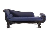 An Empire Style Gilt Metal Mounted Ebonized Chaise Longue